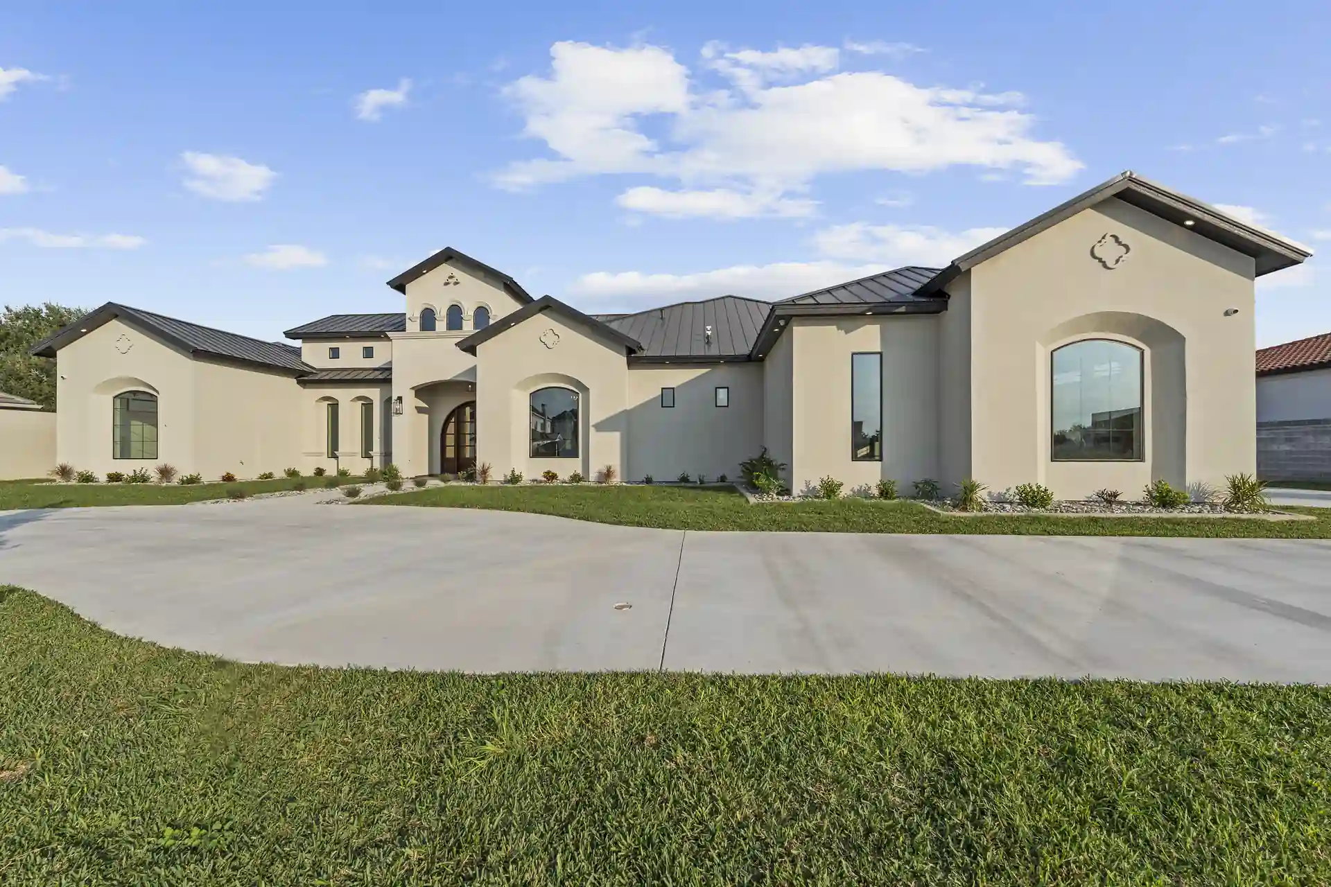 Mediterranean Custom Home — Front elevation from the drive