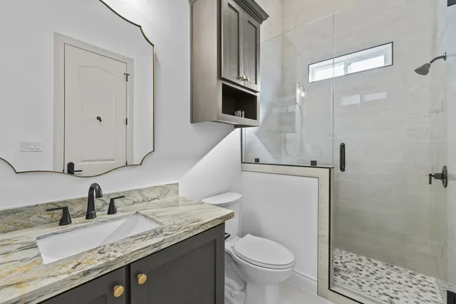 Mediterranean Custom Home — Guest bath and shower