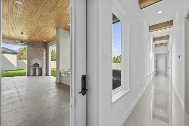Mediterranean Custom Home — Covered loggia with fireplace