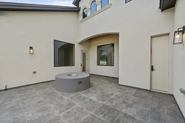 Mediterranean Custom Home — Courtyard fire pit