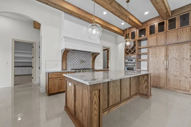 Mediterranean Custom Home — Kitchen cabinetry and wine storage