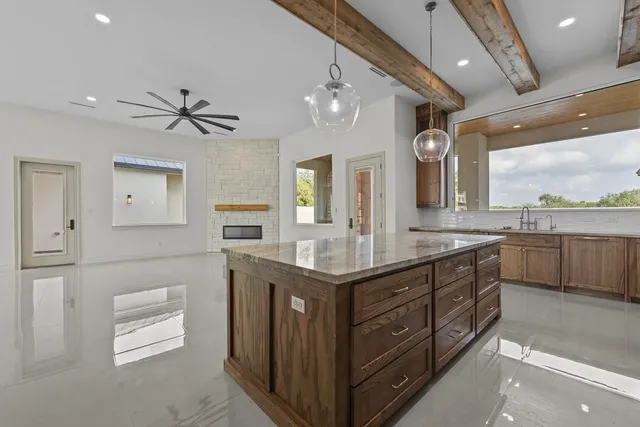 Mediterranean Custom Home — Living room and kitchen beyond
