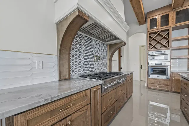 Mediterranean Custom Home — Range and tile surround