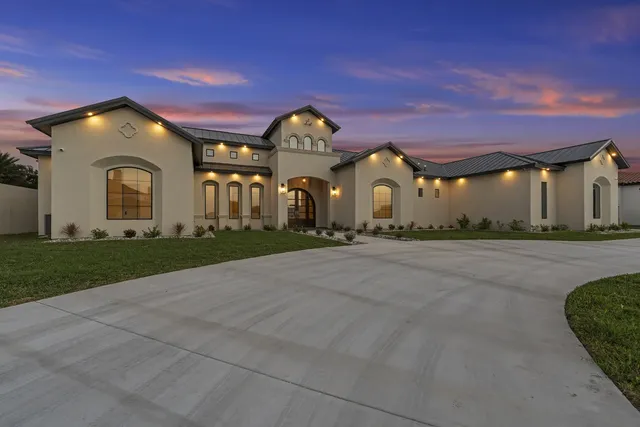 Mediterranean Custom Home — Front elevation at dusk